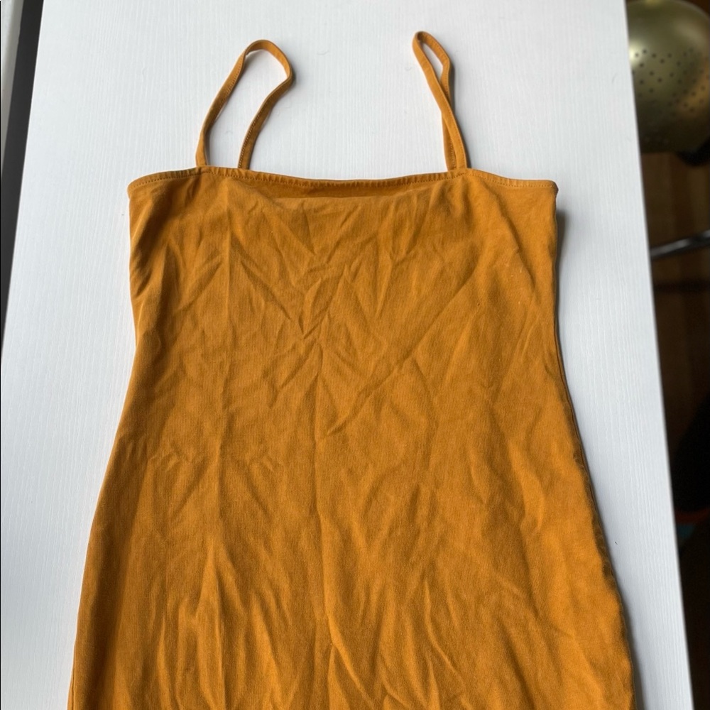 Has been worn twice. Will be washed before shipped.